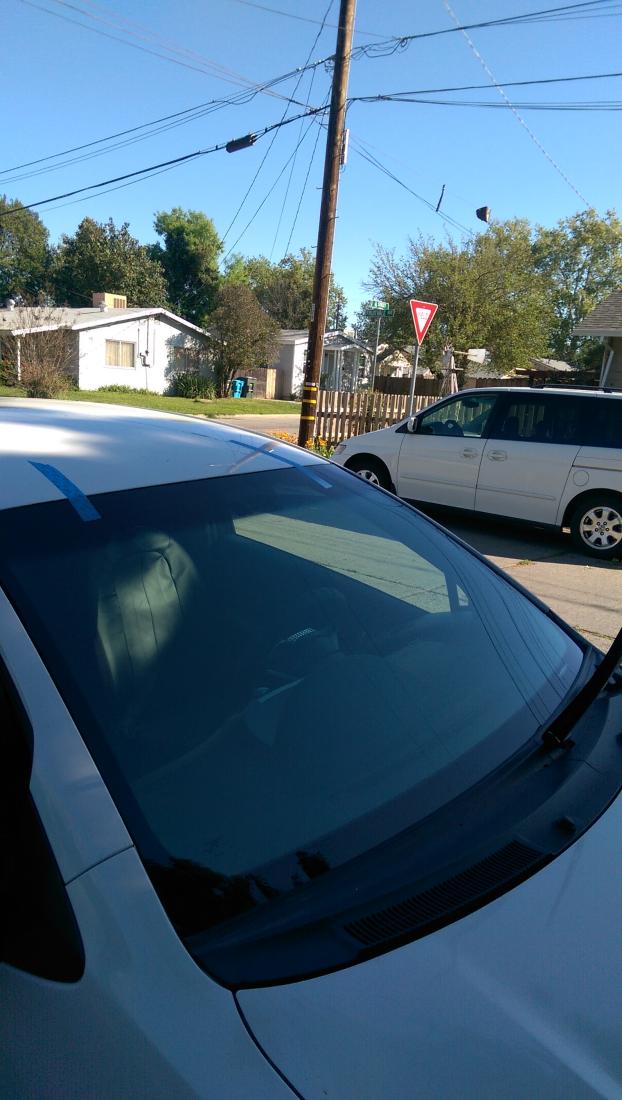 After a completed auto glass replacement project in the area